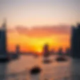 Panoramic view of Dubai Marina at sunset with dhows sailing