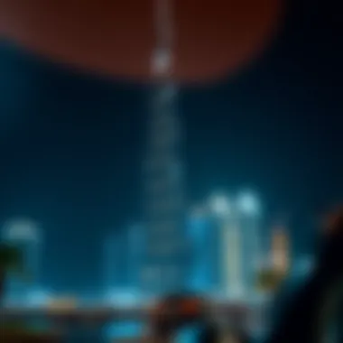 Nighttime view of Burj Daman Office Tower lit against the Dubai skyline